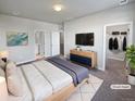 Spacious primary bedroom with ensuite bathroom and walk-in closet at 14948 E Belleview Ave, Aurora, CO 80015