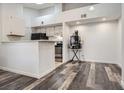 Open concept kitchen with modern appliances and ample counter space, adjacent to dining area for easy entertaining at 4760 S Wadsworth Blvd # M302, Littleton, CO 80123