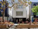 Inviting two-story modern home with manicured landscaping and contemporary design elements at 2738 N Clay St, Denver, CO 80211