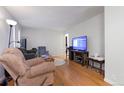 Bright living room boasting hardwood floors, comfortable seating, and natural light at 3390 S Elm St, Denver, CO 80222