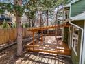 Spacious backyard deck with a custom pergola, perfect for outdoor entertaining at 9408 Harvard Dr, Highlands Ranch, CO 80130