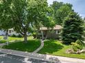 Charming single-story home with a well-manicured lawn and mature trees in a desirable neighborhood at 3061 S Marion St, Englewood, CO 80113