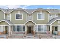 Inviting exterior of the home showcasing its well-maintained facade and front porch at 15945 E Geddes Dr # 54, Aurora, CO 80016