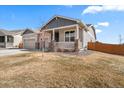 Cozy single-Gathering home with a charming front porch and well-maintained landscaping at 14632 Longhorn Dr, Mead, CO 80542