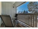 Balcony with chairs and table offers a relaxing outdoor space at 1180 S Monaco Pkwy # 3, Denver, CO 80224
