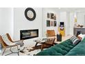 Chic living room features a modern fireplace, stylish furniture and decor, creating a cozy and inviting atmosphere at 4394 Zenobia St, Denver, CO 80212