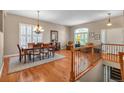Elegant dining room featuring hardwood floors, plantation shutters, and classic furnishings at 7211 Dolomite Ln, Castle Rock, CO 80108