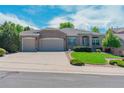 Beautiful single-story home featuring brick exterior, two-car garage, and manicured landscaping at 7211 Dolomite Ln, Castle Rock, CO 80108