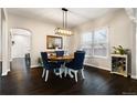 Formal dining room featuring modern lighting, hardwood floors, and an open layout at 4286 S Cole St, Morrison, CO 80465