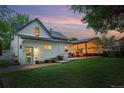 Home exterior featuring a covered patio area with outdoor dining and entertaining space at 6830 Lamar St, Arvada, CO 80003