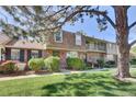 Beautiful brick townhomes with well-kept lawns, showcasing a lovely residential community at 8871 E Amherst Dr # B, Denver, CO 80231