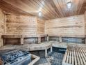 Interior view of a wood-paneled sauna with benches and a heater at 1302 S Parker Rd # 127, Denver, CO 80231