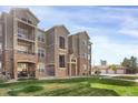 Attractive apartment building with a combination of siding and stone exterior finishes at 9227 Rolling Way # 201, Parker, CO 80134