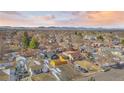 Aerial view of a residential neighborhood with mature trees at 469 S Perry St, Denver, CO 80219