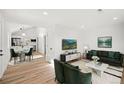 Bright living room with hardwood floors and modern decor at 469 S Perry St, Denver, CO 80219