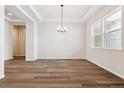 Open concept dining room features wood floors and natural light at 4723 Twelve Oaks Way, Castle Rock, CO 80104