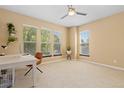 Bright office featuring three windows, neutral walls, and carpet flooring, ideal for a work-from-home space at 2488 Lake Vista Dr, Broomfield, CO 80023