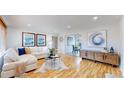 Bright and airy living room with hardwood floors and comfortable seating at 1935 Nome St, Aurora, CO 80010