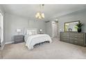 Serene main bedroom with neutral tones, a large dresser, and a chandelier at 557 S Clarkson St, Denver, CO 80209