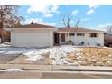 Charming white brick home with a well-manicured lawn and a two-car garage, complete with a cozy, inviting curb appeal at 2784 E Maplewood Ave, Centennial, CO 80121