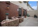 The backyard features brick planters, a decorative fountain, and a cozy outdoor space at 44 S Holman Way, Golden, CO 80401