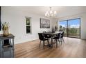Bright dining room featuring a modern chandelier, and sliding glass door to the exterior at 44 S Holman Way, Golden, CO 80401