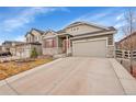 Beautiful front exterior featuring stone accents and a two-car garage in a well-maintained neighborhood at 5190 Ditmars Trl, Castle Rock, CO 80104