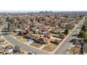 Panoramic aerial shot showcasing a suburban neighborhood with lush greenery, diverse homes, and tree lined streets at 96 S Depew Dr, Lakewood, CO 80226