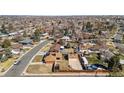 A sprawling neighborhood with single Gathering homes, mature trees, and well maintained yards under a clear sky at 96 S Depew Dr, Lakewood, CO 80226