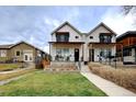 Modern two-story homes with covered porches, landscaped yards, and inviting walkways showcase community living at 2471 S High St, Denver, CO 80210