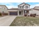 Beautiful two-story home with a front-facing two car garage and a welcoming front porch at 18948 E Baker Pl, Aurora, CO 80013
