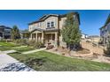 Charming home exterior with manicured lawn, covered porch, and tasteful landscaping, offering great curb appeal and a welcoming entrance at 3075 Distant Rock Ave, Castle Rock, CO 80109