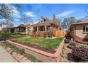 Charming red-brick home with manicured lawn and garden beds, showcasing classic architectural details and inviting curb appeal at 2772 Julian St, Denver, CO 80211