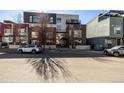 Modern condo building showcasing a mix of architectural styles and ample street parking at 2650 Front View # 205, Denver, CO 80211