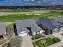 Beautiful home with well-kept lawn near a scenic golf course and lush greenery at 15046 Verbena St, Thornton, CO 80602