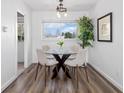 Cozy dining area with a glass table, seating for four, and a decorative tree at 3137 S Glencoe St, Denver, CO 80222