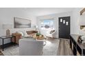 Well-lit living room with stylish furniture, sleek flooring, and an inviting atmosphere at 3137 S Glencoe St, Denver, CO 80222