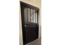 Secure front door with decorative metalwork offers both protection and aesthetic appeal at 9700 E Iliff Ave # D44, Denver, CO 80231