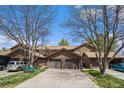 Charming townhome with an attached garage, mature trees and a spacious driveway at 718 Julian Cir, Lafayette, CO 80026