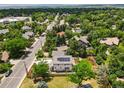 Overhead view of a charming property with mature trees, backyard and solar panels on the roof at 1321 W Caley Ave, Littleton, CO 80120