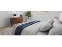 Calming bedroom with natural light, modern dresser, and relaxing decor at 2033 E 21St Ave, Denver, CO 80205