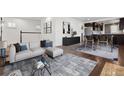Bright and airy living room featuring a comfortable sofa, stylish decor, and hardwood floors at 2033 E 21St Ave, Denver, CO 80205