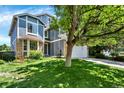 Attractive exterior showcasing a well-maintained lawn and mature trees adding shade at 9682 Hemlock Ct, Highlands Ranch, CO 80130