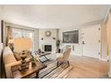 Comfortable living room with fireplace and an open concept, lots of natural light at 14602 E 2Nd Ave # 200C, Aurora, CO 80011