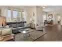 Bright and airy living room with large windows and modern furnishings at 12348 W Gould Ave, Littleton, CO 80127