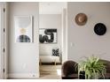 Inviting foyer featuring stylish decor and a bench, creating a warm and welcoming entrance to the home at 8280 E 36Th Ave # 27, Denver, CO 80238