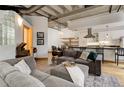 Living room featuring a gray couch, hardwood floors and a view of the kitchen at 1020 15Th St # 210, Denver, CO 80202