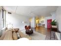 Bright living room featuring hardwood floors, large windows, and a stylish seating area with contemporary furnishings at 444 17Th St # 301, Denver, CO 80202