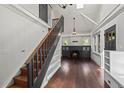 Bright living room featuring hardwood floors, skylights, a staircase, and a cozy fireplace at 1010 Euclid Ave, Boulder, CO 80302