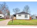 Single-story home with a freshly landscaped front yard and modern exterior at 3067 Robin Way, Denver, CO 80222